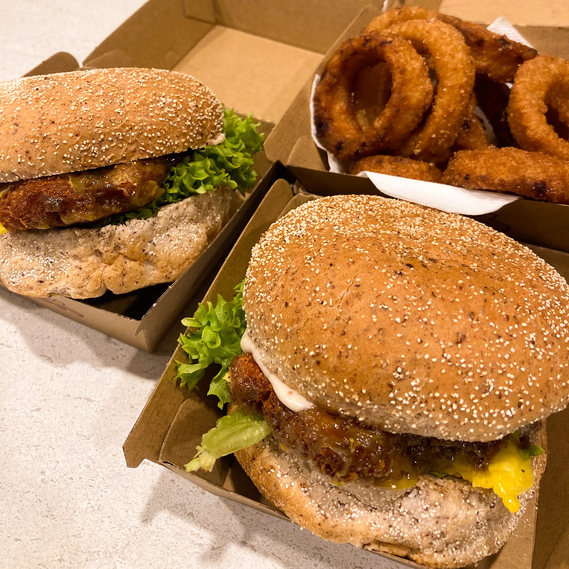 Two burgers from Slick burger and onion rings Christchurch